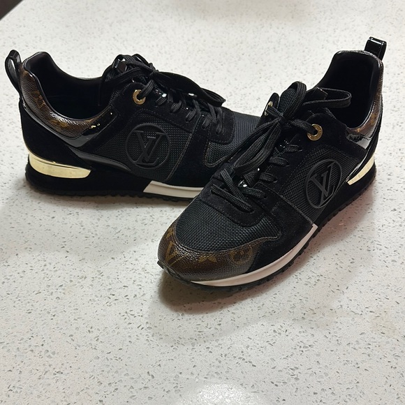 Louis Vuitton Black Sneakers with Gold Accents and Lace-Up Closure